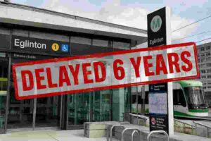 Eglinton Crosstown station in Toronto overlaid with a large “Delayed 6 Years” warning graphic