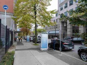 Electric vehicle charging stations installed along a Vancouver residential street.